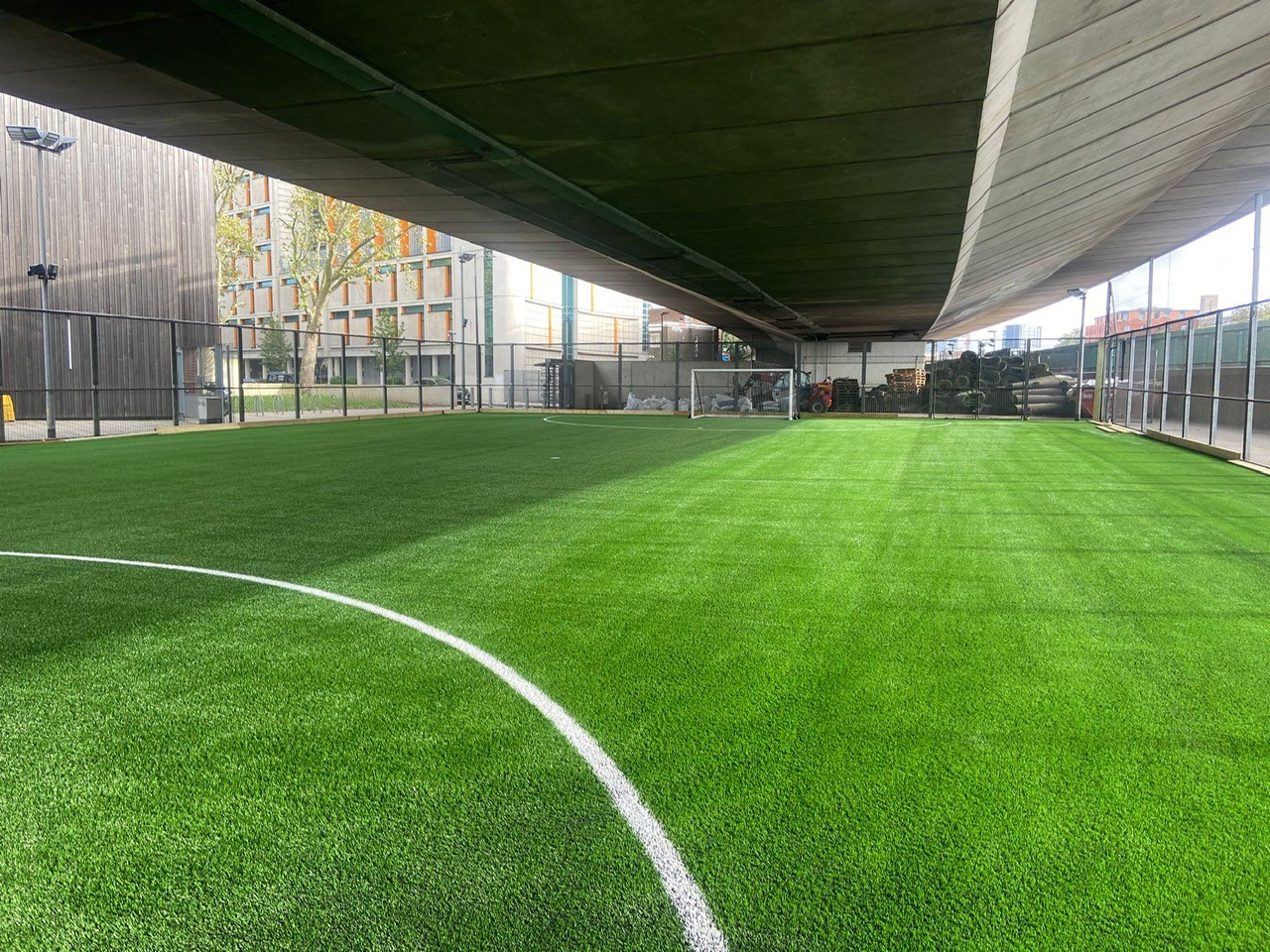Resurfacing these football pitch constructions directly underneath London’s Westway required careful traffic management and health and safety protocols.