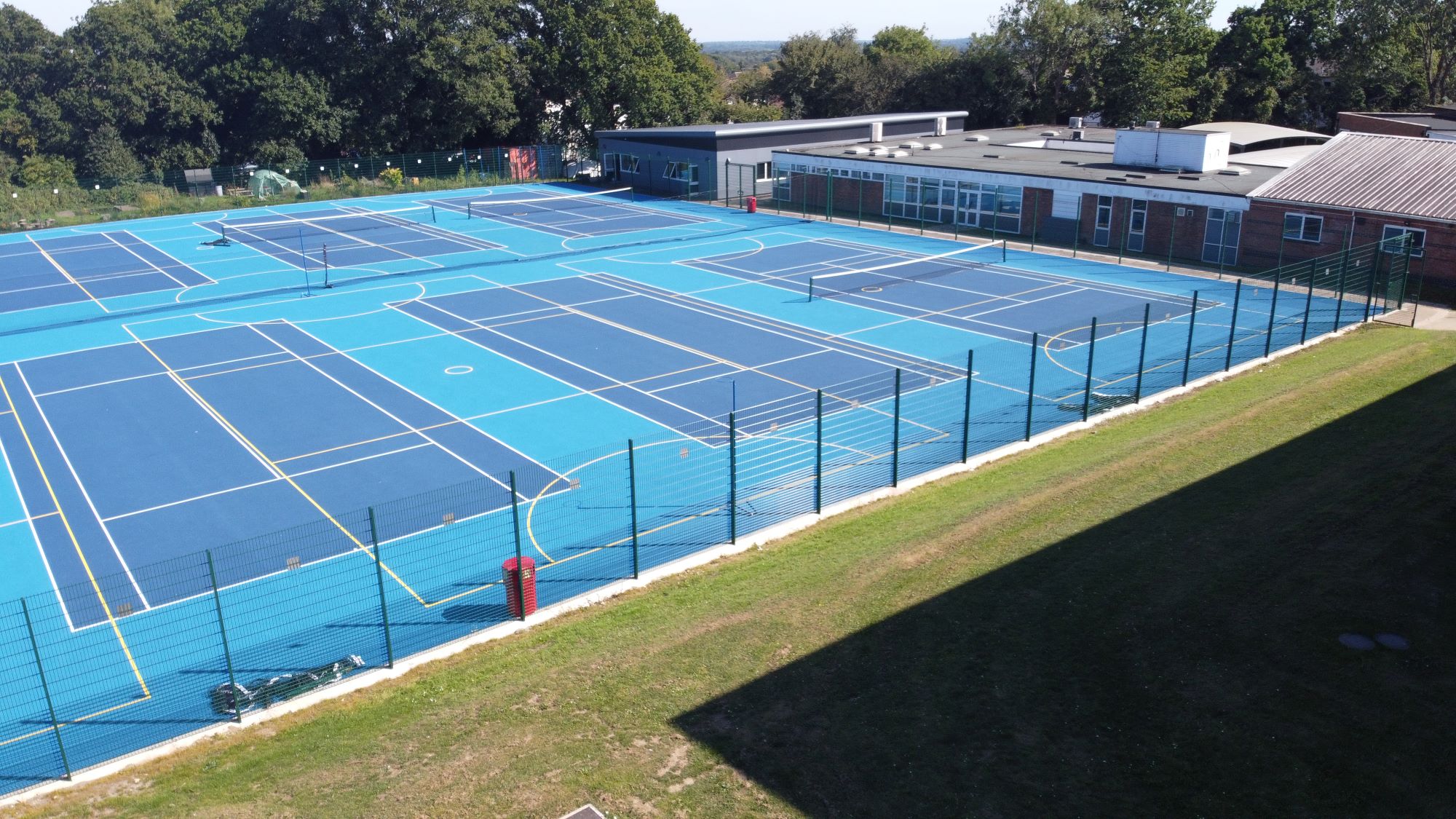 After completing new and resurfaced courts for Sandringham School, we secured the site with double wire panel MUGA fencing.